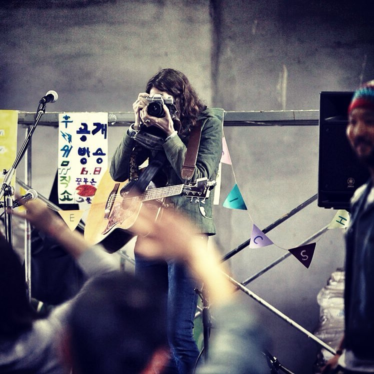 ruth taking a pic of the crowd, radish farm jeju